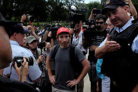 Rhys Baker of Washington, DC reacts to U.S. Park Police instruction to remove himself from the vicinity of a demonstration organized by self-proclaimed White Nationalists and members of the "Alt-Right" during what right-wing factions called a "Freedom of Speech" rally at the Lincoln Memorial in Washington, U.S. June 25, 2017. REUTERS/James Lawler Duggan