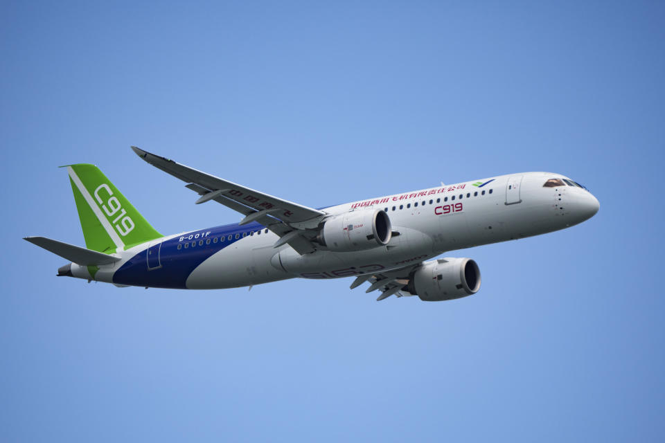 A China's Comac C919 aircraft performs during first day of Singapore Airshow in Singapore, Tuesday, Feb. 20, 2024. The Singapore Airshow – Asia’s largest – kicked off Tuesday with an array of aerial displays including some by China’s COMAC C919 narrow-body airliner. (AP Photo/Vincent Thian)