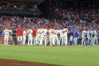 St. Louis Cardinals' Yadier Molina (4), far left, is pushed from a bench-clearing argument by teammate Matt Carpenter after he was hit by pitch during the second inning of a baseball game against the Chicago Cubs, Saturday, Sept. 28, 2019, in St. Louis. (AP Photo/Scott Kane)