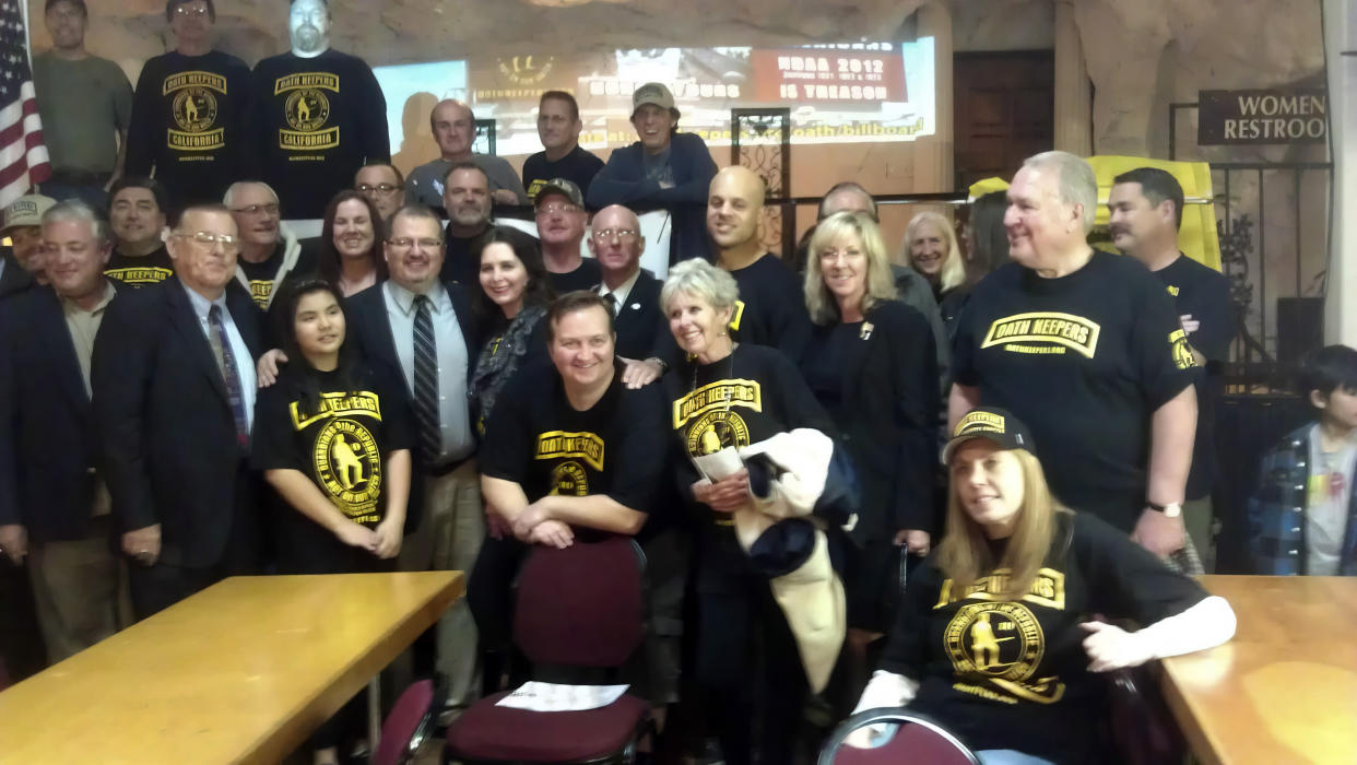 This image provided by Tasha Adams shows Oath Keepers founder Stewart Rhodes with Oath Keepers members in California in 2014. (Tasha Adams via AP)