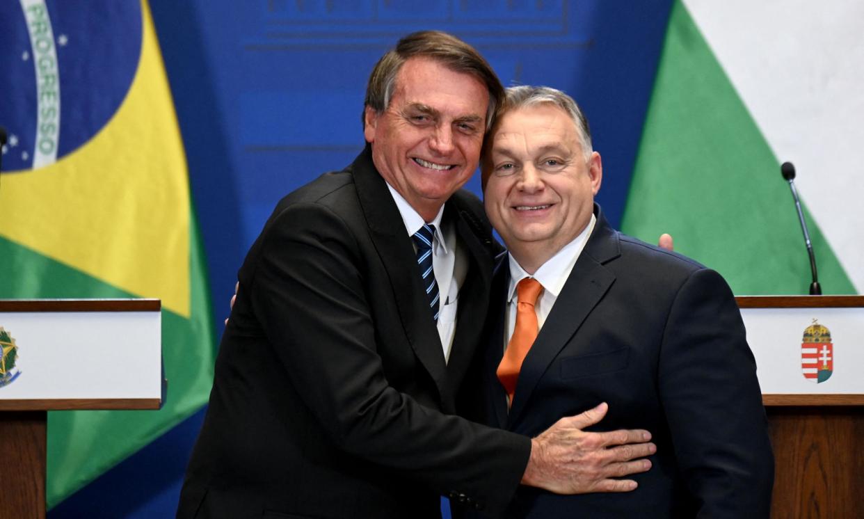 <span>Jair Bolsonaro hugs Hungary's prime minister, Viktor Orbán, right, in Budapest in 2022. ‘I won’t deny that I was in the embassy,’ he said on Monday.</span><span>Photograph: Attila Kisbenedek/AFP/Getty Images</span>