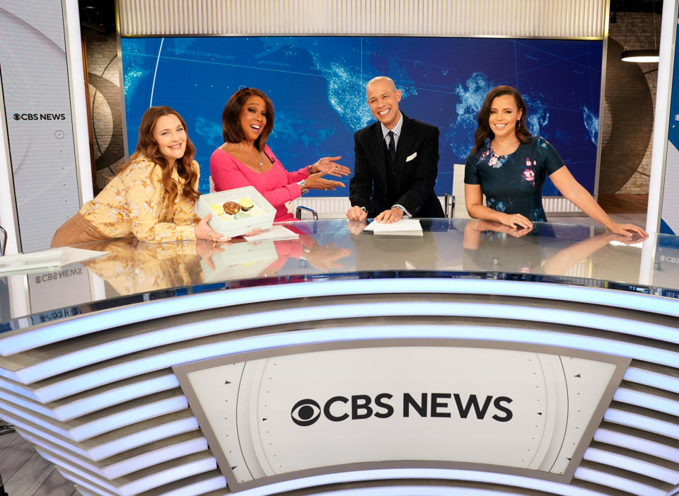 <p>Drew Barrymore and Gayle King stop by CBS Studios in N.Y.C. to surprise anchors Vladimir Duthiers and Anne Marie Green with a sweet treat to celebrate the launch of the CBS News Streaming Network. </p>