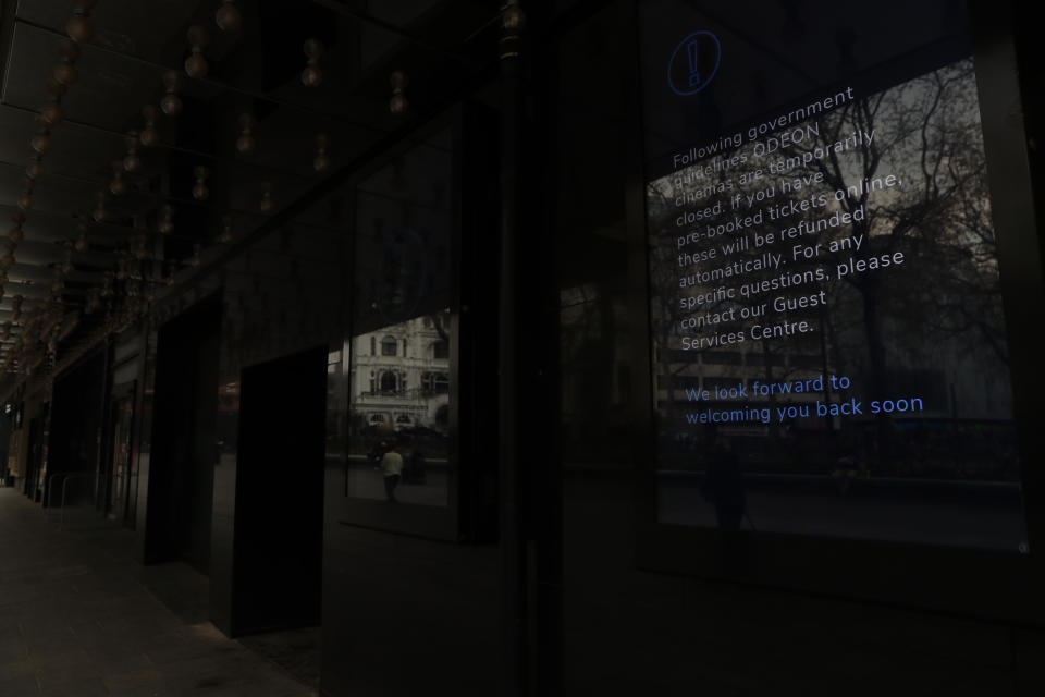 A view of an information board outside the flagship Odeon cinema in Leicester Square, in London, Tuesday, April 20, 2021. The coronavirus pandemic has devastated British theater, a world-renowned cultural export and major economic force. The theaters in London's West End shut when lockdown began in March 2020, and have remained closed for most of the past 13 months. Now they are preparing, with hope and apprehension, to welcome audiences back. (AP Photo/Alastair Grant)
