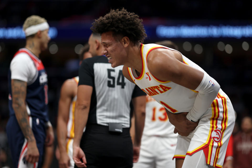 Jalen Johnson landed hard on his left wrist after trying to throw down a dunk over Kyle Kuzma on Saturday night.