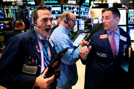 Traders work on the floor of the New York Stock Exchange (NYSE) shortly after the opening bell in New York, U.S., May 24, 2016. REUTERS/Lucas Jackson