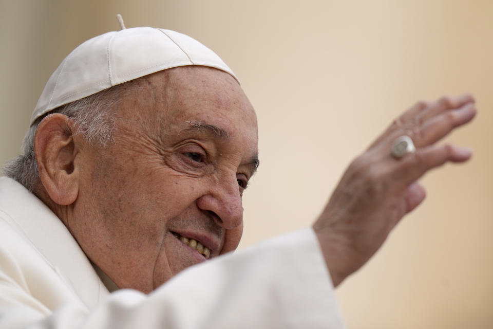 Pope Francis waves faithful as he arrives for his weekly general audience in St. Peter's Square, at the Vatican, Wednesday, April 3, 2024. (AP Photo/Alessandra Tarantino)