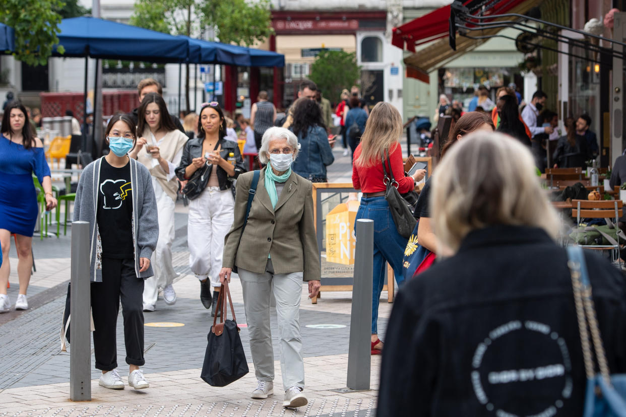 People wearing face coverings in Kensington, London. Some MPs are reportedly calling for the government to stop publishing daily COVID data. (PA)