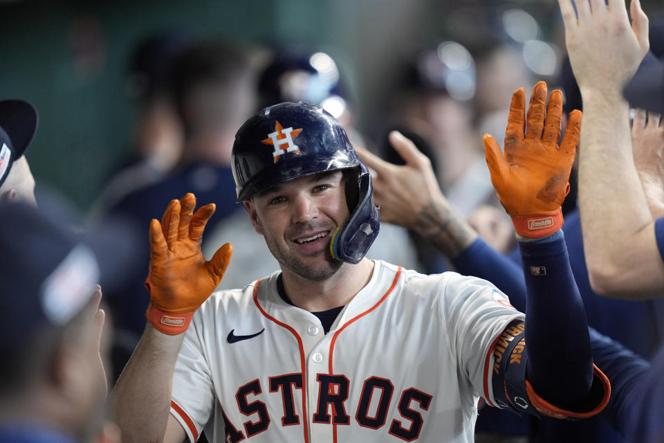 Houston Astros' Chas McCormick celebrates in the dugout after hitting a three-run home run against the Detroit Tigers during the seventh inning of a baseball game Saturday, June 15, 2024, in Houston. (AP Photo/David J. Phillip)