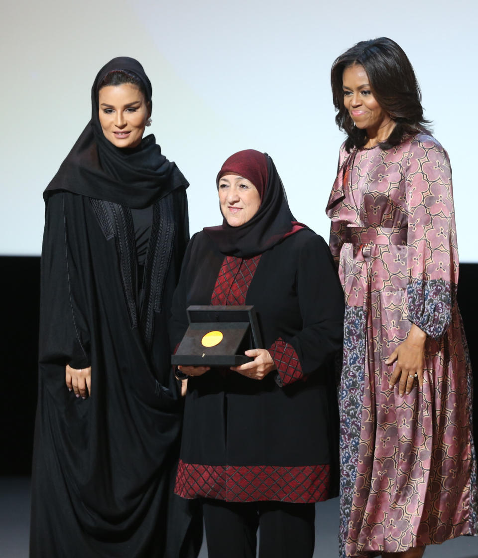 Michelle Obama in Dries van Noten to present the 2015 WISE Prize for Education to Sakena Yacoobi, the founder and CEO of the Afghan Institute of Learning, with Sheikha Mozah. 