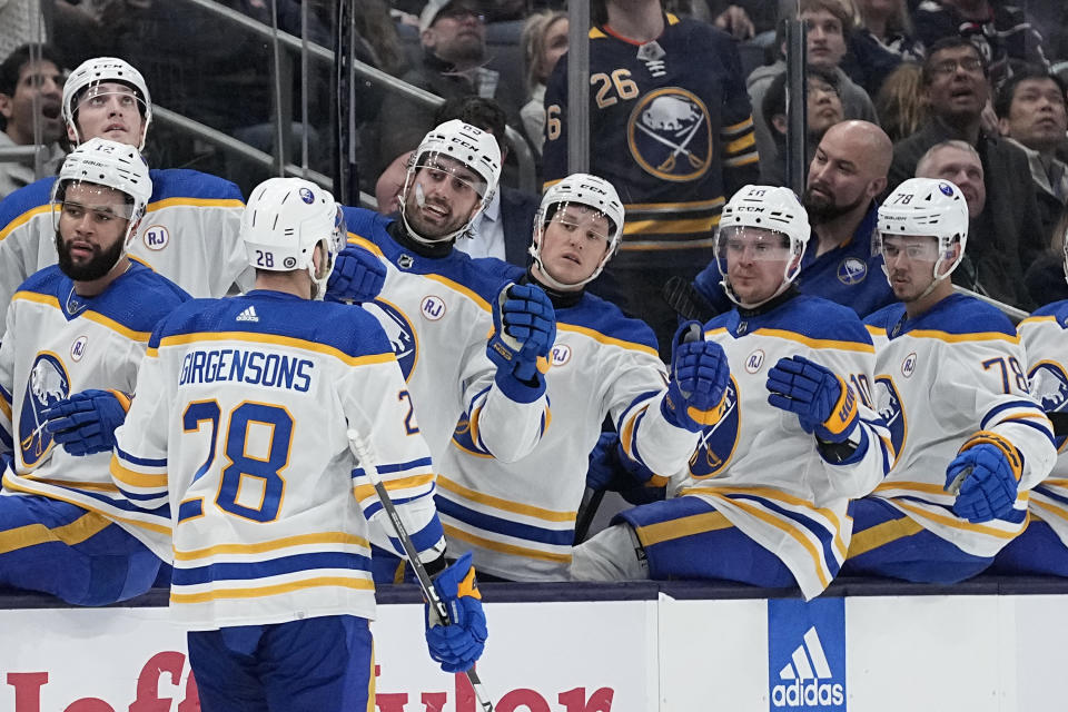 Buffalo Sabres left wing Zemgus Girgensons (28) is congratulated for his goal against the Columbus Blue Jackets during the first period of an NHL hockey game Friday, Feb. 23, 2024, in Columbus, Ohio. (AP Photo/Sue Ogrocki)