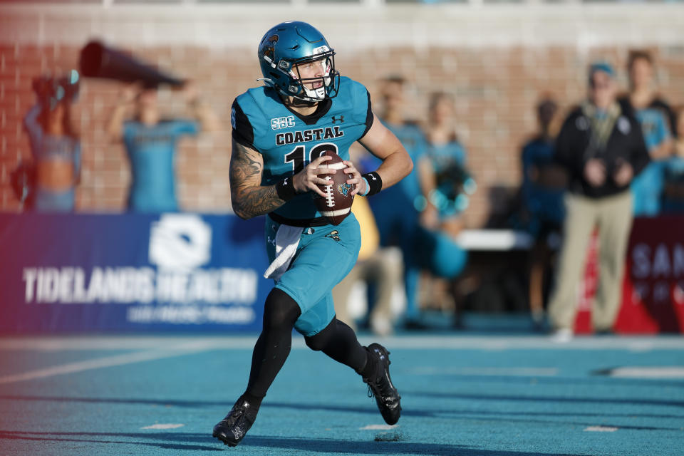 Coastal Carolina quarterback Ethan Vasko looks to pass against James Madison during the first half of an NCAA college football game in Conway, N.C., Saturday, Nov. 25, 2023. (AP Photo/Nell Redmond)
