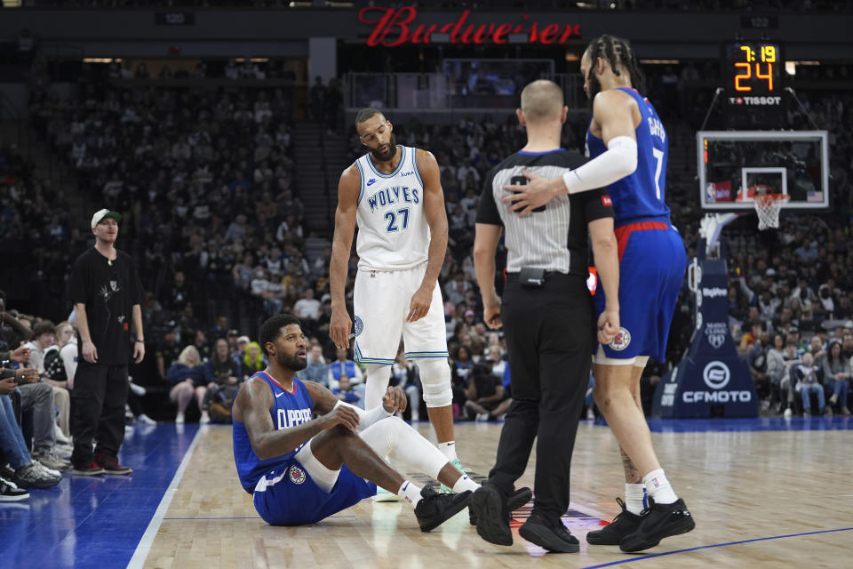 Minnesota Timberwolves center Rudy Gobert (27) reacts after being called for a foul during the first half of an NBA basketball game against the Los Angeles Clippers, Sunday, March 3, 2024, in Minneapolis. (AP Photo/Abbie Parr)