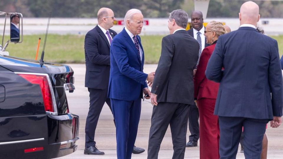 President Joe Biden is greeted by Gov. Roy Cooper after arriving via Air Force One at RDU International Airport Tuesday, March 28, 2023. Biden went on Wolfspeed in Durham Tuesday where he launched his Investing in America Tour.