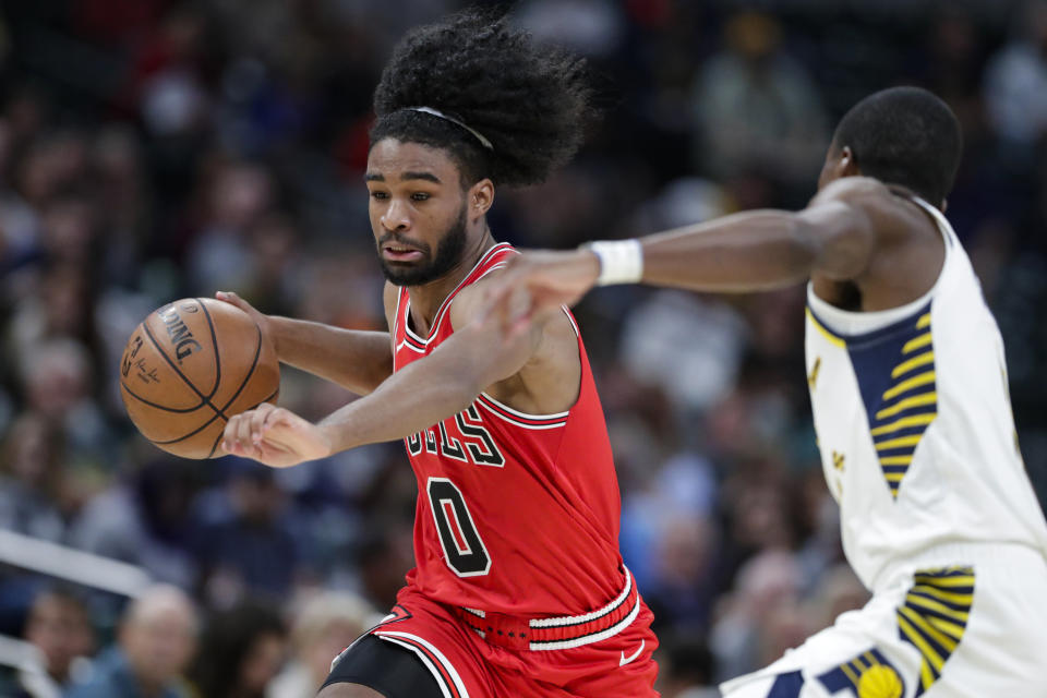 Chicago Bulls guard Coby White (0) drives on Indiana Pacers guard Edmond Sumner during the second half of an NBA preseason basketball game in Indianapolis, Friday, Oct. 11, 2019. (AP Photo/Michael Conroy)