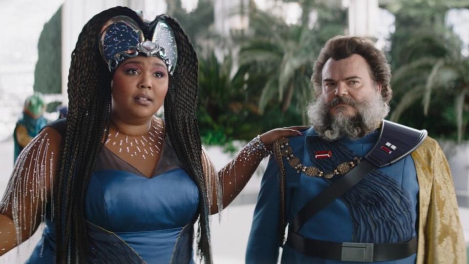 Lizzo in a big headdress with her hand on a bearded Jack Black on The Mandalorian