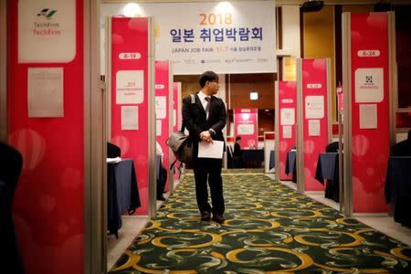 A jobseeker looks at a booth during the 2018 Japan Job Fair in Seoul, South Korea, November 7, 2018. REUTERS/Kim Hong-Ji/Files