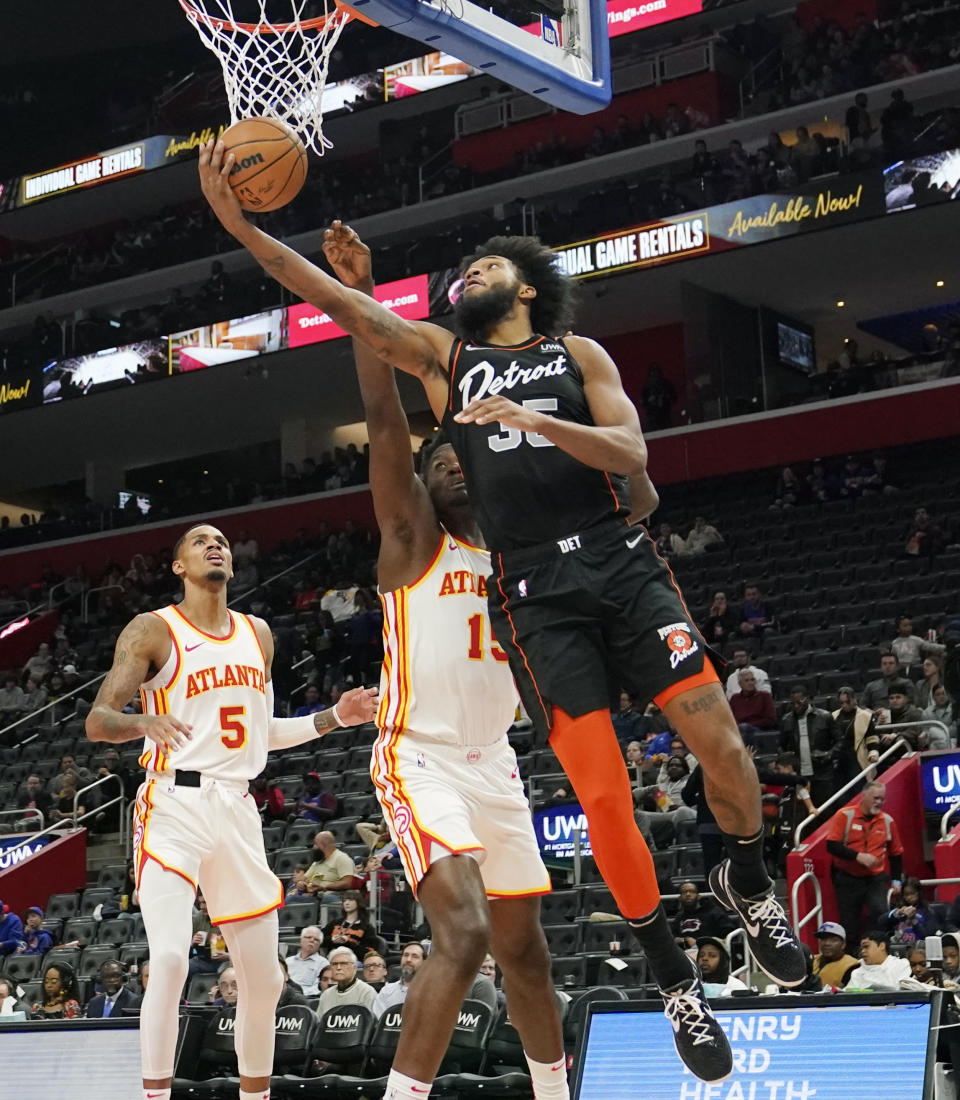 Detroit Pistons forward Marvin Bagley III (35) attempts a layup as Atlanta Hawks center Clint Capela (15) defends during the second half of an NBA basketball game, Tuesday, Nov. 14, 2023, in Detroit. (AP Photo/Carlos Osorio)