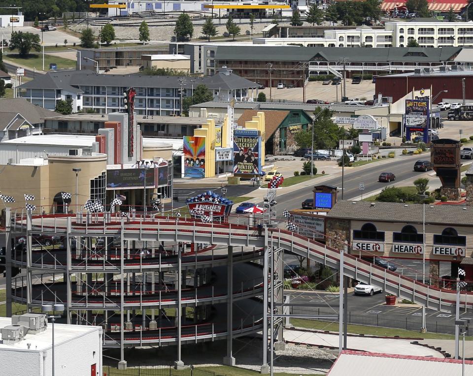 Center-left in this photo, the Jim Stafford Theater's red guitar neck marquee is shown along with the yellow Caravelle Theater along Branson's Highway 76 strip in this 2016 News-Leader file photo. Both theaters are to be demolished, but the Jim Stafford marquee will be removed for safekeeping on Nov. 16.