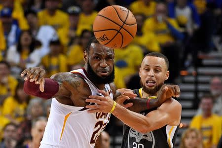 June 3, 2018; Oakland, CA, USA; Golden State Warriors guard Stephen Curry (30) and Cleveland Cavaliers forward LeBron James (23) go for a loose ball during the second quarter in game two of the 2018 NBA Finals at Oracle Arena. Kyle Terada-USA TODAY Sports