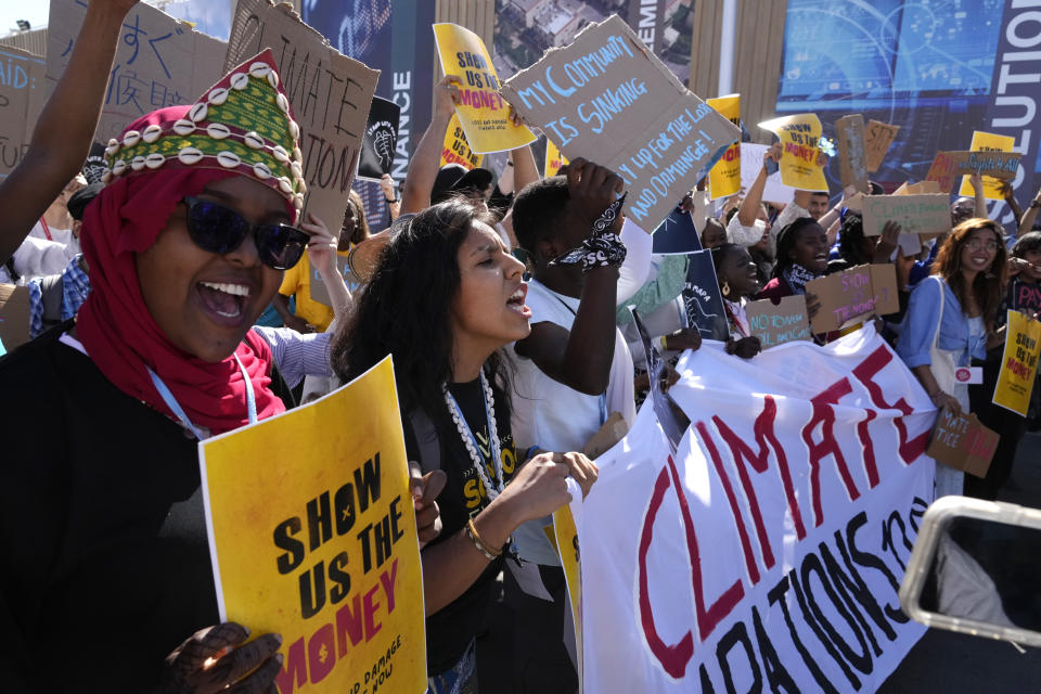 Demonstrators participate in a Fridays for Future protest calling for money for climate action at the COP27 U.N. Climate Summit, Friday, Nov. 11, 2022, in Sharm el-Sheikh, Egypt. (AP Photo/Peter Dejong)