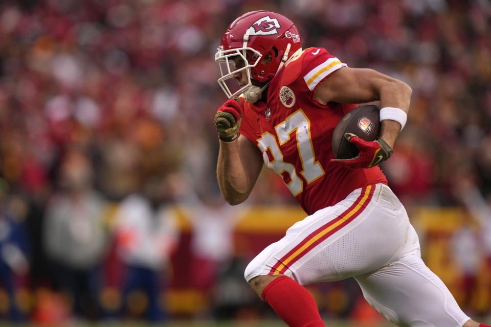 Kansas City Chiefs tight end Travis Kelce (87) runs up field during a 39-yard touchdown reception in the first half of an NFL football game against the Los Angeles Rams Sunday, Nov. 27, 2022, in Kansas City, Mo. (AP Photo/Charlie Riedel)