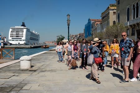 The cruise ship MSC Opera loses control and crashes against a smaller tourist boat at the San Basilio dock in Venice