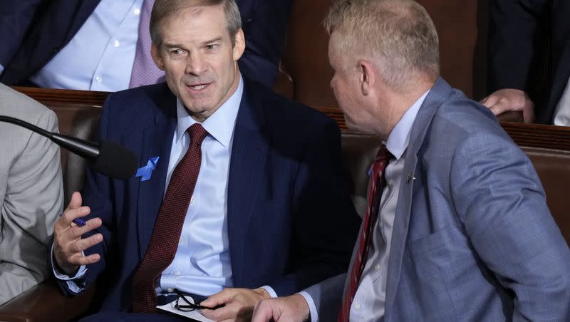 Rep. Jim Jordan, R-Ohio, chairman of the House Judiciary Committee, left, speaks with Rep. Warren Davidson, R-Ohio, right, as Republicans try to elect Jordan to be the new House speaker, at the Capitol in Washington, Wednesday, Oct. 18, 2023. The second vote to elect Jordan was unsuccessful.