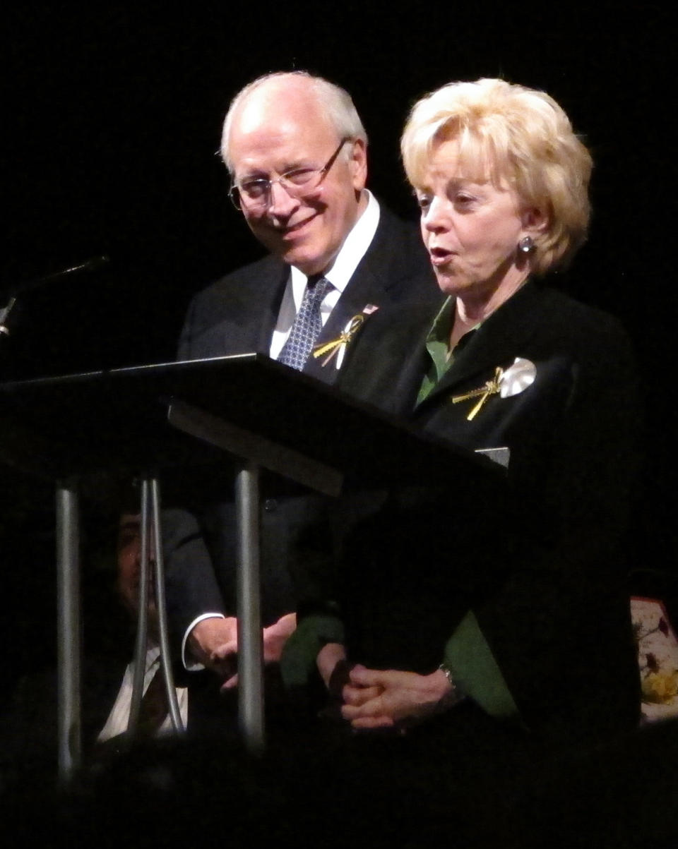 Lynne Cheney speaks about former Wyoming Treasurer Joe Meyer at a memorial service for him on Friday, Oct. 19, 2012, at the Cheyenne Hills Church in Cheyenne, Wyo. Former Vice President Dick Cheney, Meyer's longtime friend, stands behind her. (AP Photo/Ben Neary)