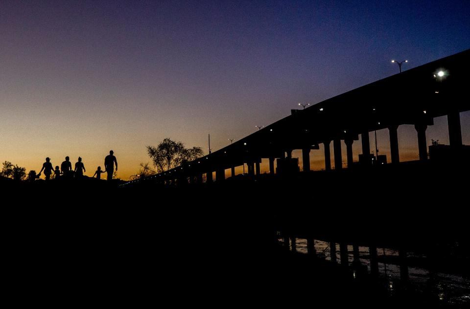 Haitian migrants cross the Rio Grande from Ciudad Juárez, Mexico to El Paso, Texas on May 17, 2022. The migrants evaded Mexican National Guard and quickly crossed the river embankment and turned themselves into Customs and Border Protection officers on the U.S. side of the international border.