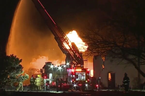 FILE – In this frame grab taken from video provided by WXYZ, firefighters battle an industrial fire in the Detroit suburb of Clinton Township, March 4, 2024. Noor Noel Kestou, a suburban Detroit businessman, was charged with involuntary manslaughter Thursday, April 25, in connection with an explosion at the building he owned in which a nitrous oxide cannister propelled through the air, striking and killing another man. (WXYZ via AP, File)