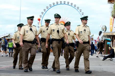 German police officers patrol the grounds of the 182nd Oktoberfest in Munich, Germany, September 19, 2015. REUTERS/Michaela Rehle/File Photo