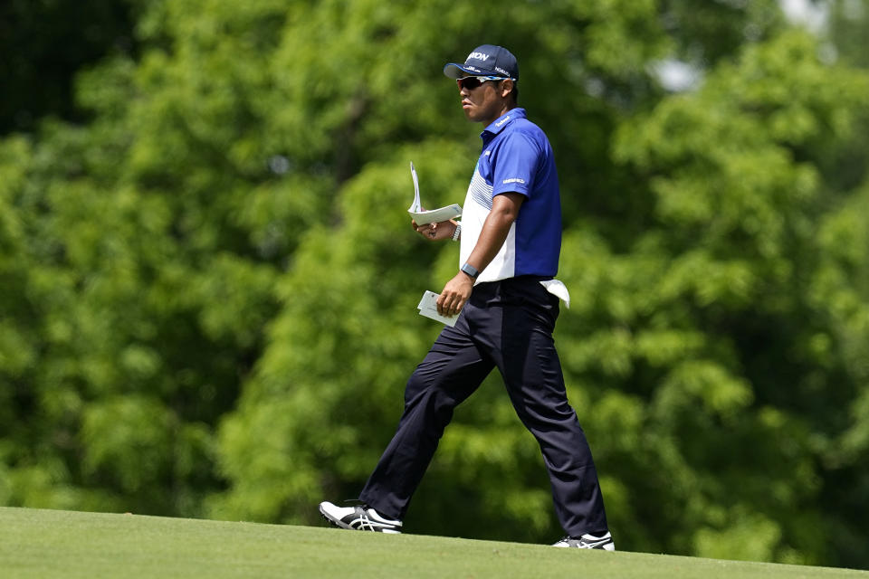 Hideki Matsuyama, of Japan, walks on the ninth fairway during the first round of the Memorial golf tournament, Thursday, June 2, 2022, in Dublin, Ohio. (AP Photo/Darron Cummings)