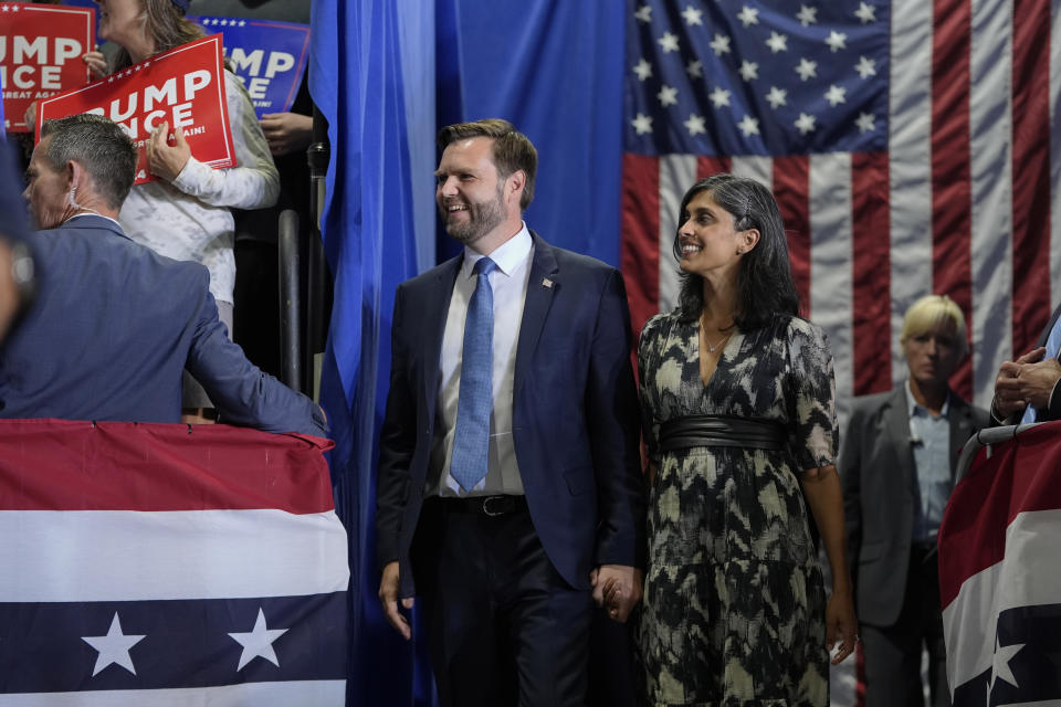 Republican vice presidential nominee Sen. JD Vance, R-Ohio, arrives with his wife Usha Vance, before speaking at a campaign event, Tuesday, Sept. 17, 2024 in Eau Claire, Wis. (AP Photo/Abbie Parr)