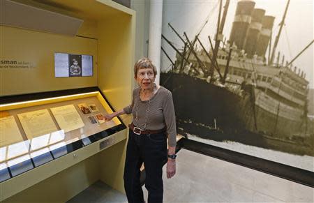 U.S. author Sonia Pressman Fuentes from Sarasota, Florida, points to photos of her parents while visiting the "Millions of People, One Dream" exhibition at the Red Star Line Museum in Antwerp September 24, 2013. REUTERS/Yves Herman