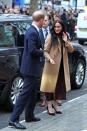 <p>For her first engagement of 2020, Meghan chose a camel-colored coat, which she wore over a brown turtleneck and midi-length skirt.</p>