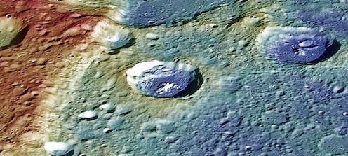 <span class="caption">Perspective view of a lobate scarp on Mercury named Carnegie Rupes, colour-coded according to surface altitude. The crater near the middle is nearly 40 km across.</span> <span class="attribution"><a class="link " href="https://www.nasa.gov/image-feature/a-striking-perspective" rel="nofollow noopener" target="_blank" data-ylk="slk:NASA/Johns Hopkins University Applied Physics Laboratory/Carnegie Institution of Washington;elm:context_link;itc:0">NASA/Johns Hopkins University Applied Physics Laboratory/Carnegie Institution of Washington</a></span>