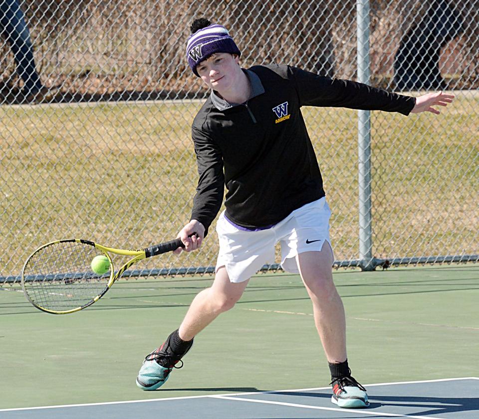 Watertown's Curtis Sneden hits a forehand return during a high school boys tennis triangular on Monday, April 17, 2023 at the Highland Park Tennis Courts in Watertown.