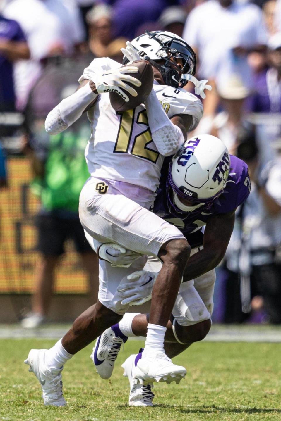 Colorado wide receiver Travis Hunter (12) catches a deep pass in the fourth quarter of a college football game between the TCU Horned Frogs and the Colorado Buffaloes at Amon G. Carter Stadium in Fort Worth on Saturday, Sept. 2, 2023.