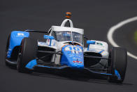 Alex Palou, of Spain, drives through the first turn during qualifications for the Indianapolis 500 auto race at Indianapolis Motor Speedway in Indianapolis, Saturday, May 21, 2022. (AP Photo/Michael Conroy)