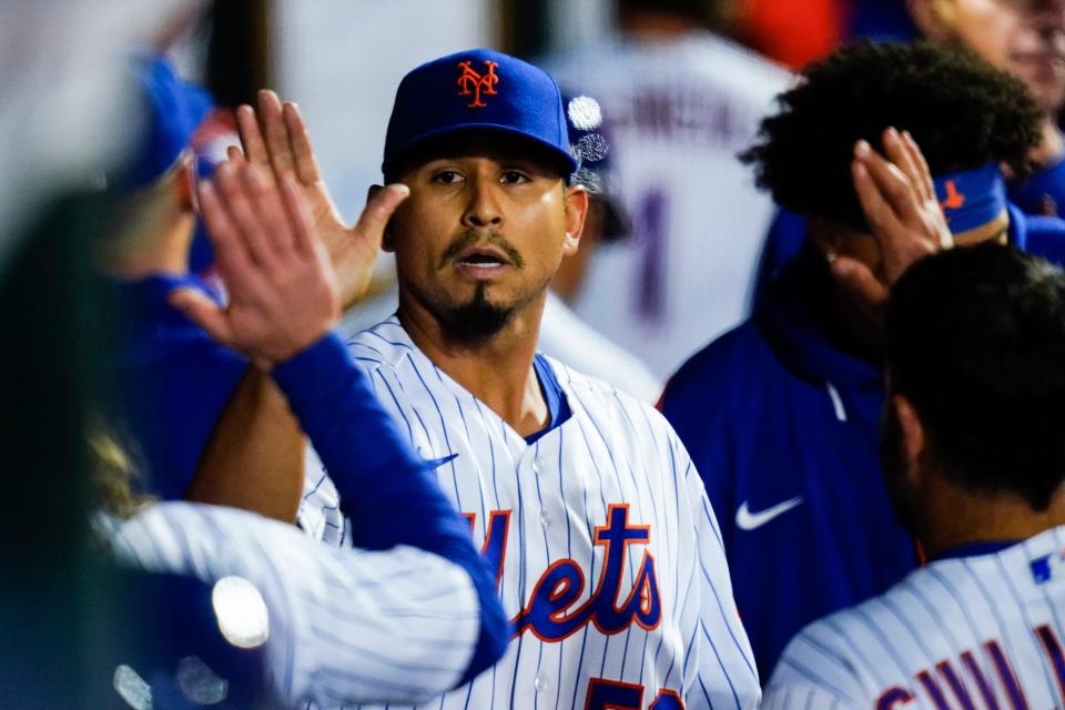 New York Mets starting pitcher Carlos Carrasco celebrates with teammates during the seventh inning of the second baseball game of the team's doubleheader against the Atlanta Braves on Tuesday, May 3, 2022, in New York.