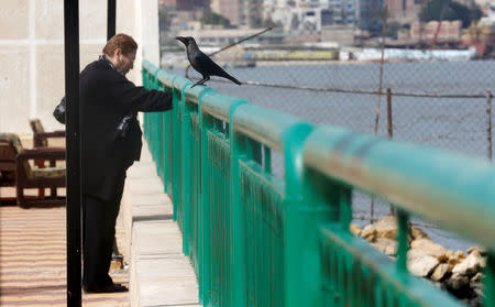 A Christian woman who left with her family from Al-Arish city North Sinai’s Governorate capital after the escalation of a campaign targeting Christians by Islamic State militants last week, looks on and rest near a crow at a youth guest house in Ismailia, northeast of Cairo, Egypt February 27, 2017. Picture taken February 27, 2017. REUTERS/Amr Abdallah Dalsh