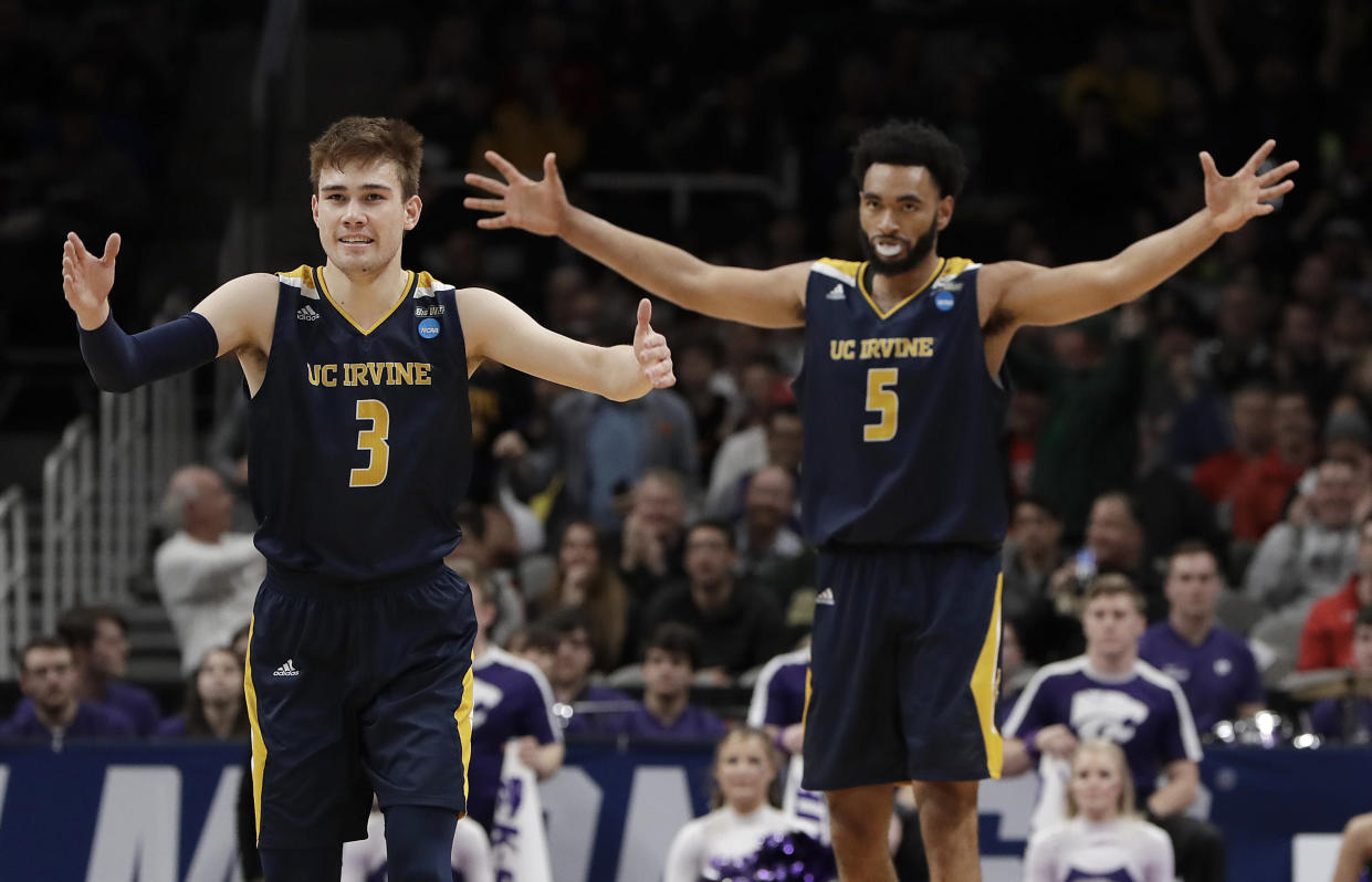 UC Irvine guard Robert Cartwright (3) and forward Jonathan Galloway (5) celebrate against Kansas State during the second half of a first round men's college basketball game in the NCAA Tournament Friday, March 22, 2019, in San Jose, Calif. (AP Photo/Chris Carlson)