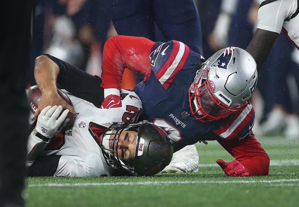 Patriots linebacker Matt Judon, a member of the 2021 free-agent class signed by New England, sacks Buccaneers quarterback Tom Brady during a game in October.