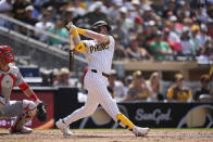 San Diego Padres' Jake Cronenworth watches his grand slam during the seventh inning of a baseball game against the Cincinnati Reds, Wednesday, May 1, 2024, in San Diego. (AP Photo/Gregory Bull)