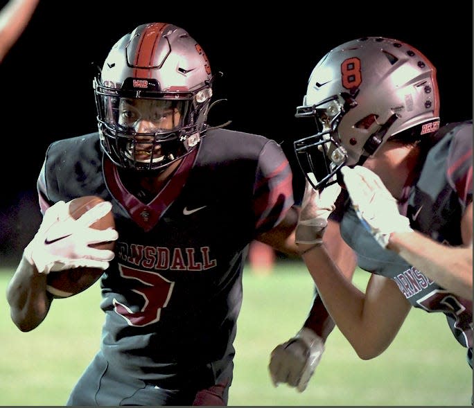 Barnsdall High School's James Johnson, left, has been a gritty performer this season. He is shown in home action in the 2023 season, against Drumright High.