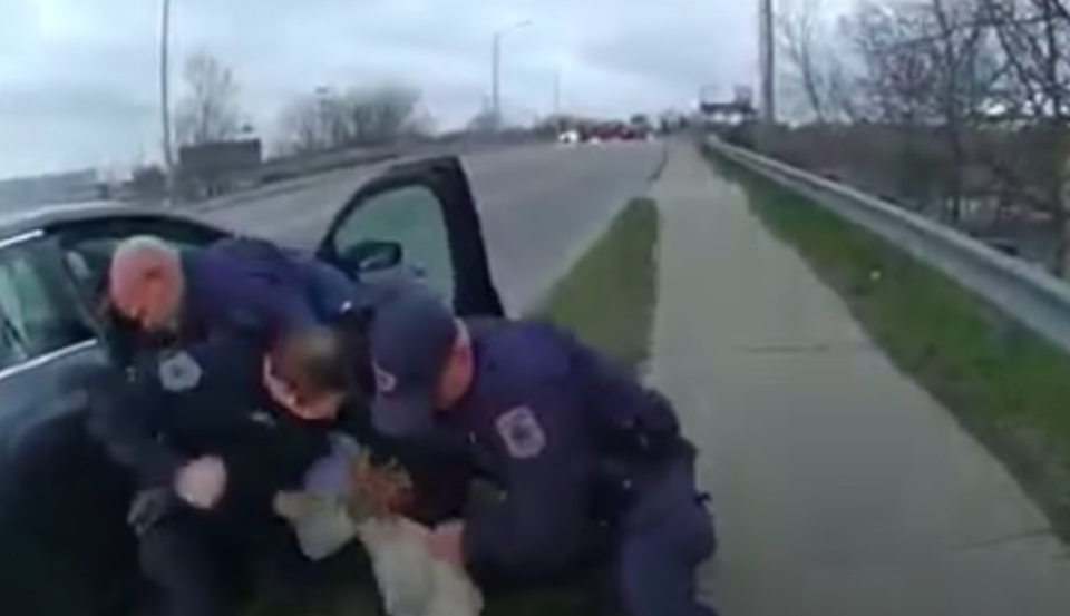 <h5>Body cam footage shows Grand Rapids cops punching a Black man several times in the face. Screengrab</h5> (MLive YouTube)