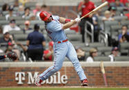 St. Louis Cardinals' Paul Goldschmidt swings for a three-run home run off Atlanta Braves' Josh Tomlin during the fifth inning of the first baseball game of a doubleheader on Sunday, June 20, 2021, in Atlanta. (AP Photo/Ben Margot)