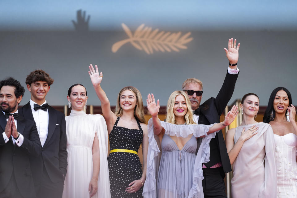 Alejandro Edda, from left, Hayes Costner, Jena Malone, Georgia MacPhail, Sienna Miller, Kevin Costner, Ella Hunt, and Wase Chief pose for photographers upon arrival at the premiere of the film 'Horizon: An American Saga' at the 77th international film festival, Cannes, southern France, Sunday, May 19, 2024. (Photo by Scott A Garfitt/Invision/AP)