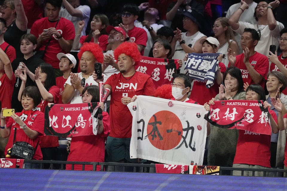 Japan's supporters celebrate after the team defeated Finland in the Basketball World Cup group E match in Okinawa, southern Japan, Sunday, Aug. 27, 2023. (AP Photo/Hiro Komae)