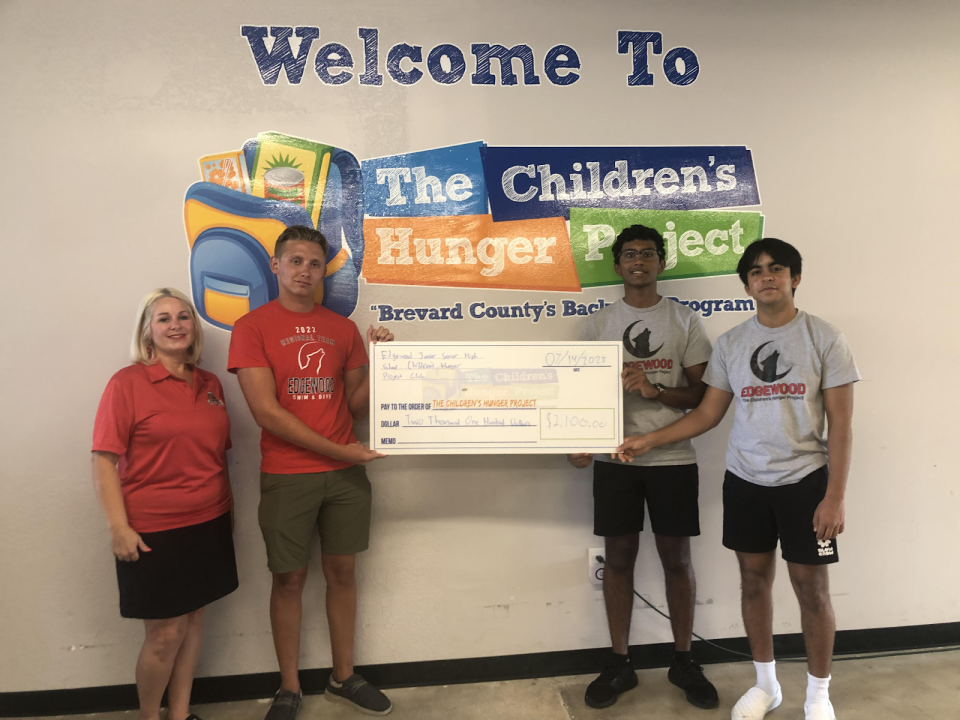 Edgewood Jr./Sr. High School students William Struble, Thejas Kumar and Arnav Jain, with their sponsor, Meredith Reninger, recently presented at $2,100 donation to the Children's Hunger Project.